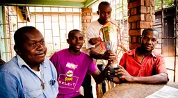 Congolese refugees proudly display the cup they won in a football tournament for youths from refugee communities in Kampala (Photo: Stephen Luke, Creative Commons via Flickr)