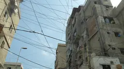 When infrastructure is not provided, or not affordable, the urban poor find their own way around the problem, as in Delhi, India, where electricity is tapped