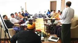 Men sitting in a conference room