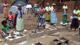 Women using the Changu Changu Moto Fuel-Efficient Clean Cookstove, Malawi, Africa (Photo: Ripple Africa)