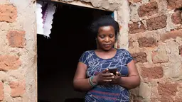 Mobile devices enable people to access a wide range of resources: in Kampala Jane Zamukunda got free legal advice from Barefoot Law via her phone (Photo: King Baudouin African Development Prize, Creative Commons via Flickr)