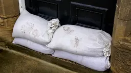 Sandbags in a doorway to prevent flooding