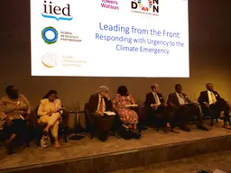 The panellists sitting on stage at the event