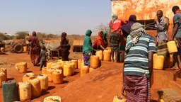 Women fetching water at a water kiosk
