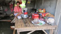 A woman sitting on a raised platform