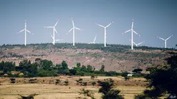 Wind turbines on the top of a hill