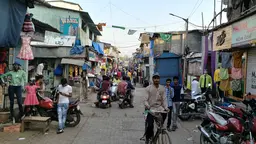 A busy side street in the settlement of Dharavi