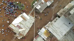 An aerial view of people in an informal settlement