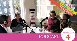 Four people sat around a table speaking into microphones