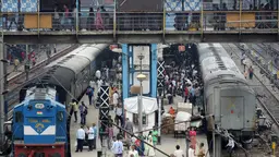 Passengers at a busy train station