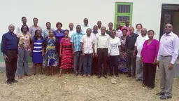 A group of men and women outside a building