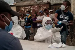 People wearing face masks and medical suits