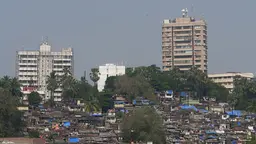 Informal housing and tall buildings behind.