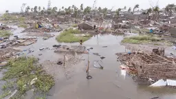 A flooded village with damaged houses.