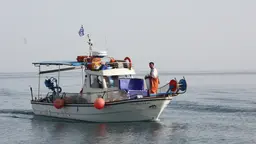 A small fishing boat on the sea. 