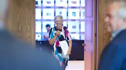 Liz Carlile holding a microphone