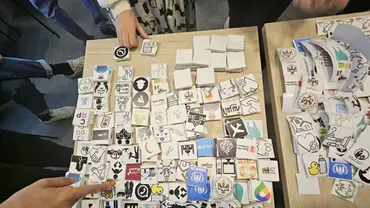 A table covered in cards with pictures on them. 