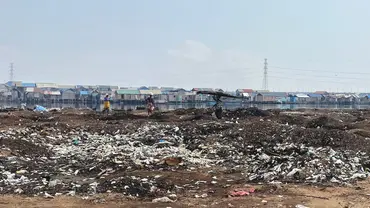 Site of a forced eviction of an informal settlement in Lagos, Nigeria. Person walking through the settlement.