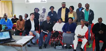 Group of standing and seated people pose for a photo