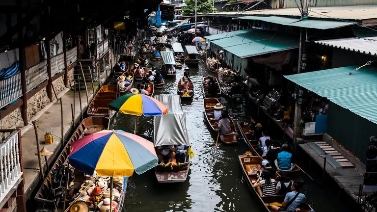 A bustling riverway in Bangkok, Thailand