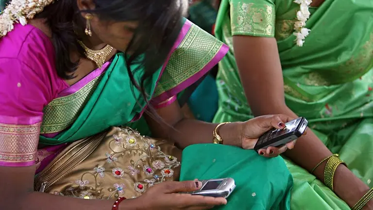 Woman holding to mobile phones