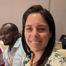 A woman smiling at the camera.