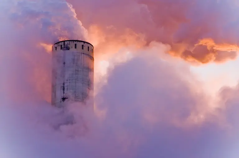 A chimney expelling smoke.