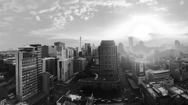 Grayscale photo of city buildings