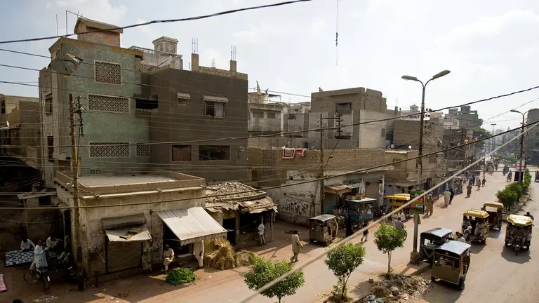 Overview of the Nawalane neighbourhood, street with buildings on one side.