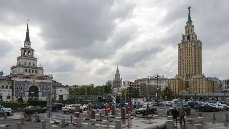 City traffic and buildings in Stalinist architecture.