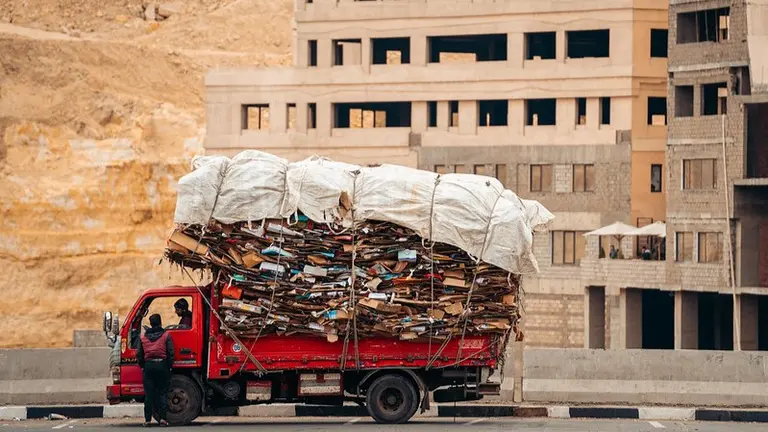 Truck carrying a huge load of cardboard.