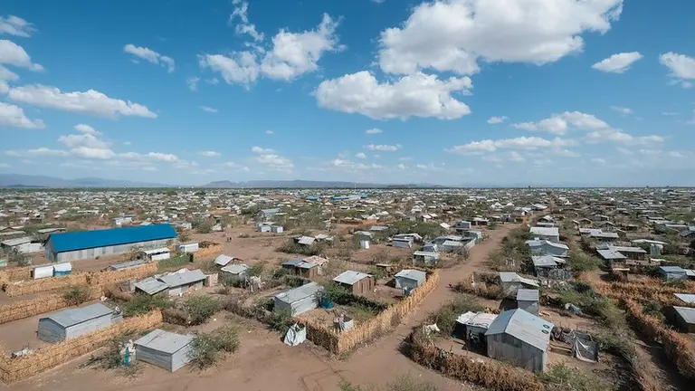 Aerial view of desert refugee camp with makeshift homes.