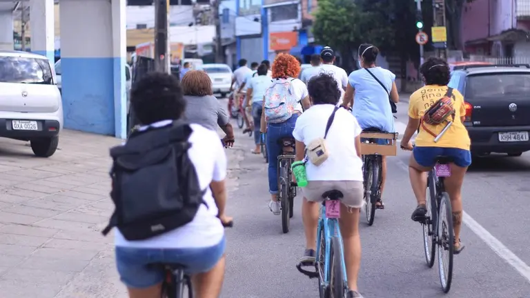 Group of people riding bikes.