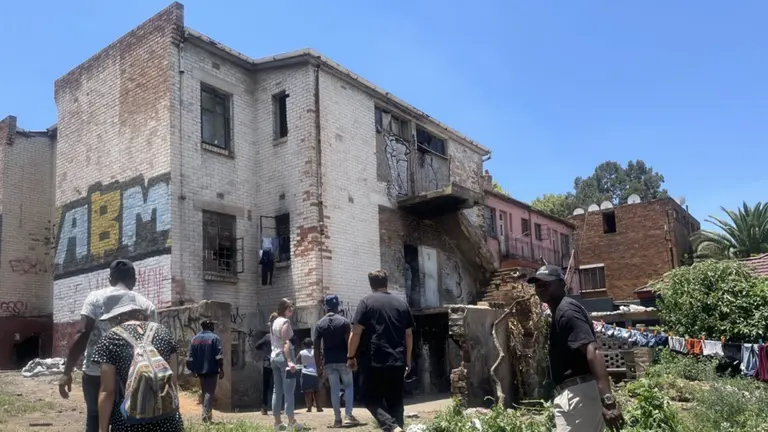 A group of people outside of a building