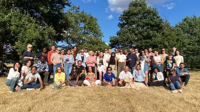 Group photo of IIED staff members and family in Hyde Park during the IIED London 2024 picnic.