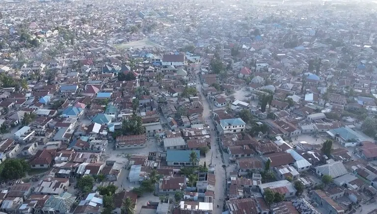 An aerial view of an informal settlement showing building packed tightly together.