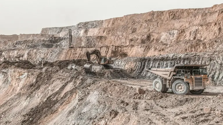 Image of trucks working in a copper mine