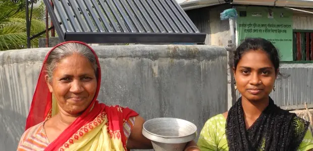 Collecting water from a solar-based purification system supplied by CAFOD. Chila Union, Mongla District, Bangladesh. Photo: Photo: Paula Nyunt / CAFOD