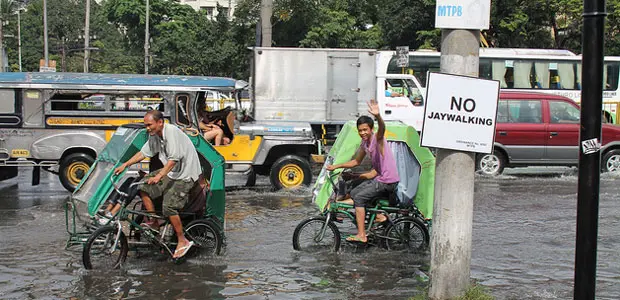 Pedicabs on the flooded streets of Manila, Philippines. 