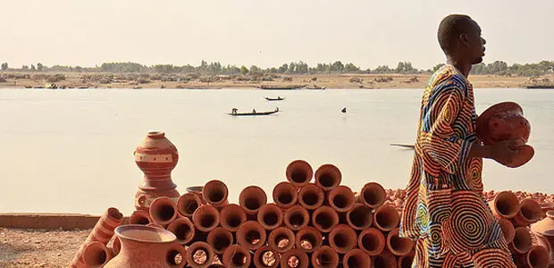 A man walks past the river Niger in Mopti, Mali. 
