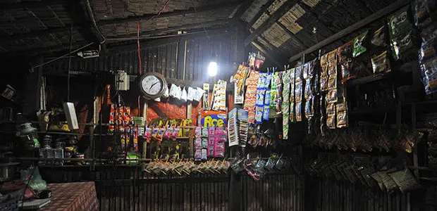 A solar lamp lights up a shop.