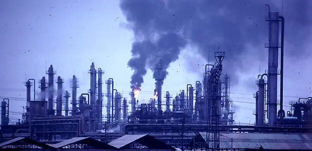 Polluted air coming out of the smoke stacks of a factory in Shanghai, China.