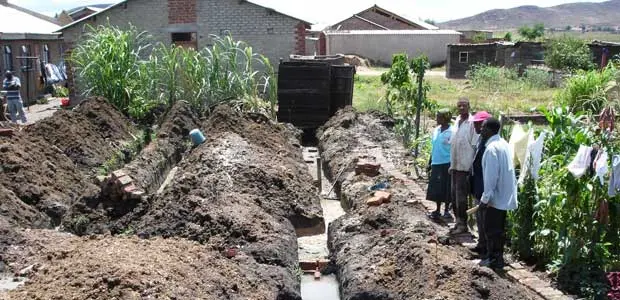 Members of the Zimbabwe Homeless People's Federation learn techniques for building houses on land that is affected by climate-related hazards, including waterlogging. Picture: David Dodman.