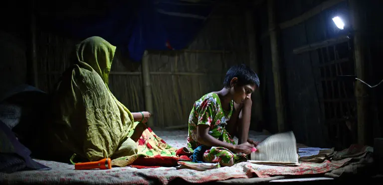 In the absence of electricity, students in Bangladesh are given charger lights so they can study at home (Photo: G.M.B. Akash/PANOS)