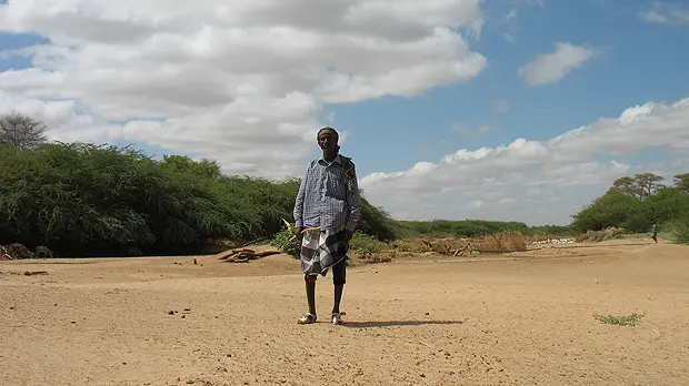 Resource scouts such as Abdelkader, pictured in the Ewaso Ng'iro river bed, Isiolo County, gauge how best to use dry-season grazing areas (Photo: Caroline King-Okumu/IIED)