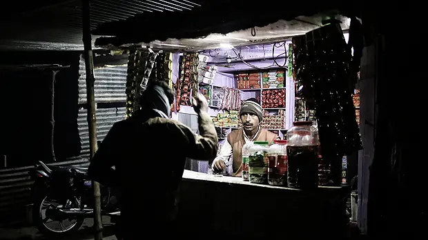 A vendor in India uses energy produced by a micro-grid funded by SunFunder (Photo: Sameer Halai/SunFunder)