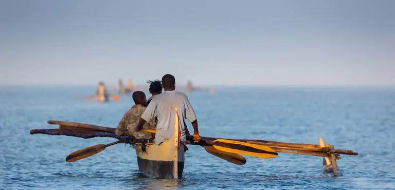 Madagascan fishermen set out for a day's fishing in traditional dugout canoes. Madagascar is implementing community-based management for some of its marine resources (Photo: Andreas Hafenscher, Creative Commons via Flickr)
