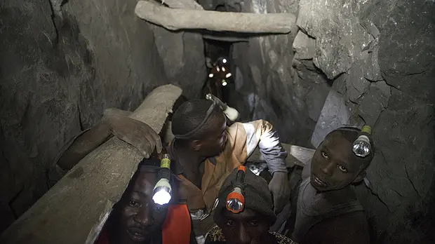 Employees work deep within a tunnel at the Nsangano Gold Mine, Mawemeru village in Geita District, Tanzania in March 2015 (Photo: Brian Sokol/Panos Pictures)