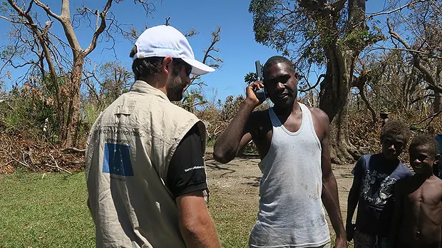 A satellite phone provided by Télécoms Sans Frontières, with European Commission funding, enables a man from Tanna island to finally talk to loved ones ten days after communications were cut off by Cyclone Pam in March 2015 (Photo: TSF, Creative Commons, via Flickr)