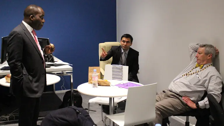 Discussions continue during a working lunch